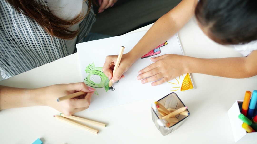Small creative team gathered around a table discussing a project