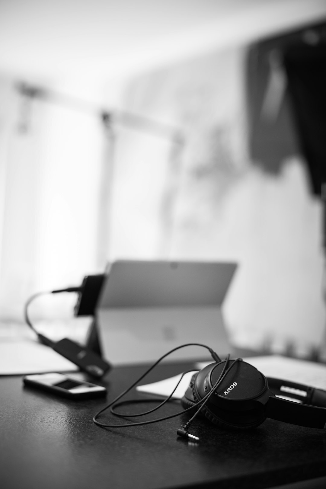 Podcast recording setup with microphones and headphones on a table